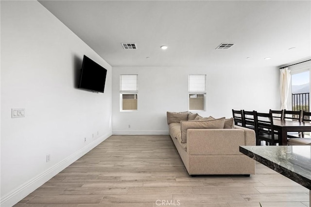 living room with light hardwood / wood-style floors