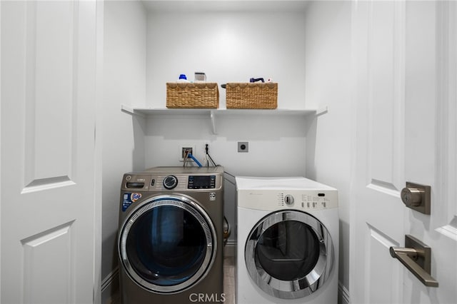 washroom with independent washer and dryer