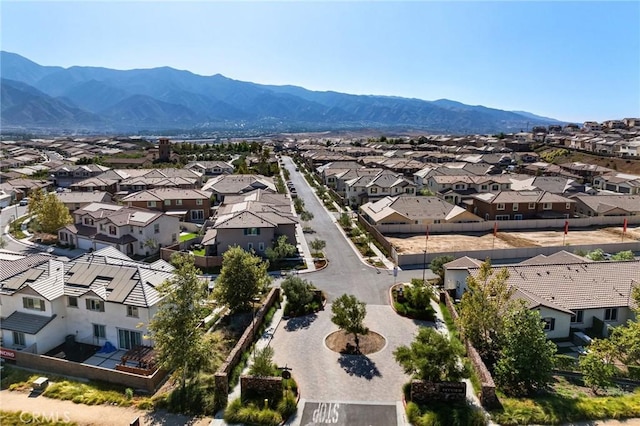 birds eye view of property featuring a mountain view