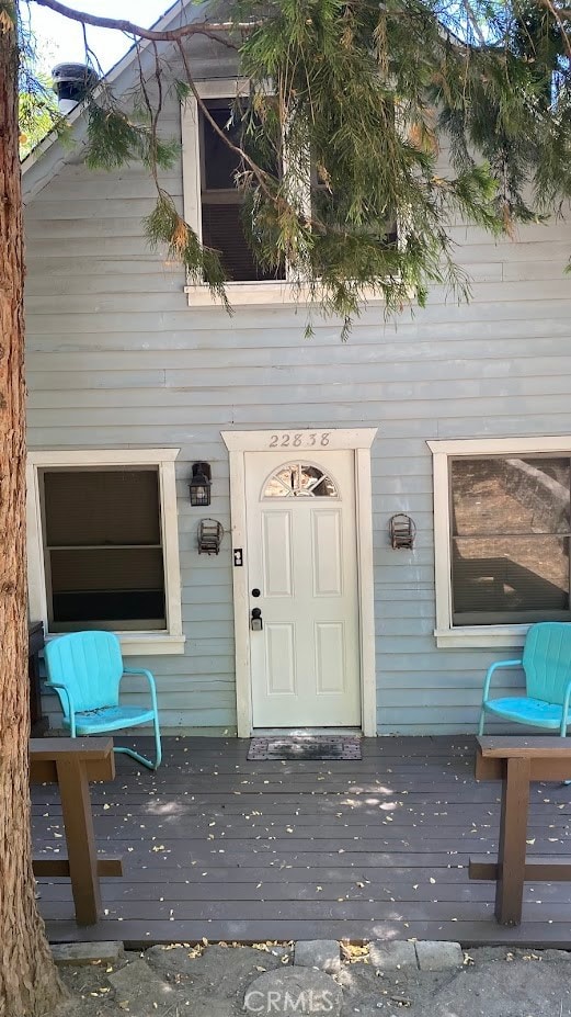 doorway to property featuring a deck