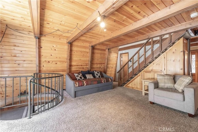 living room featuring dark colored carpet, beam ceiling, and wooden ceiling