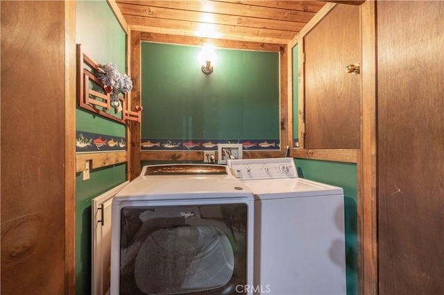 washroom with washer and dryer, cabinets, and wooden ceiling