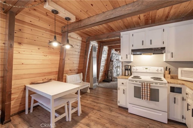 kitchen with white appliances, pendant lighting, beamed ceiling, white cabinets, and light hardwood / wood-style floors