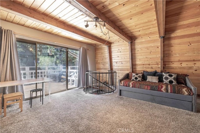 interior space with beam ceiling, carpet, wood ceiling, and access to outside