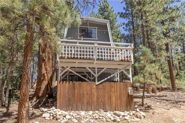 back of property with a wooden deck