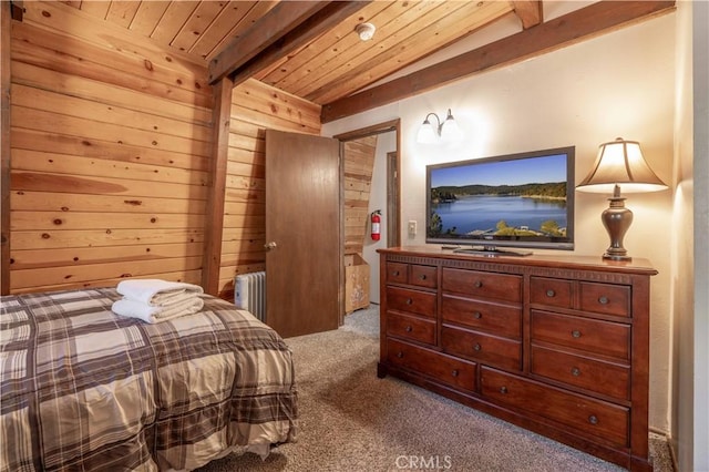 bedroom with carpet, wood walls, radiator, lofted ceiling with beams, and wood ceiling