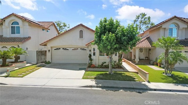 mediterranean / spanish home with a front yard