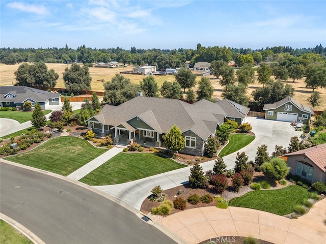 birds eye view of property with a residential view