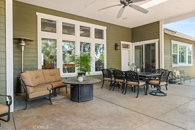 view of patio featuring a ceiling fan and outdoor dining space