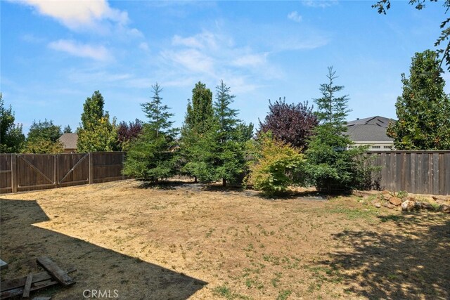 view of yard with a fenced backyard