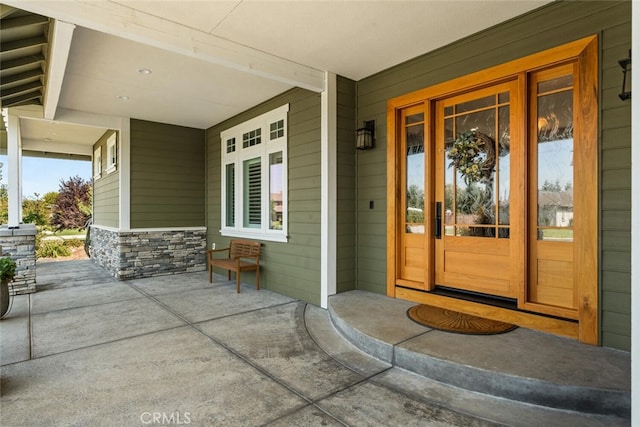 property entrance with covered porch