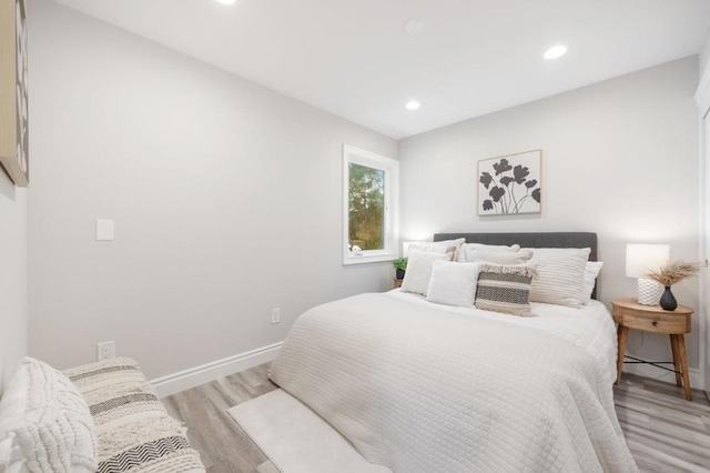 bedroom with light wood-type flooring