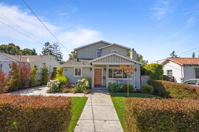 view of front of house featuring a front yard and covered porch