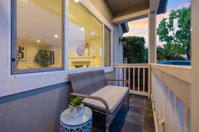 view of balcony at dusk