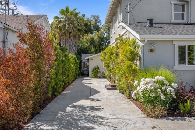 view of side of property featuring a patio area