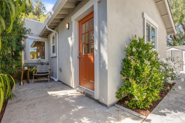 doorway to property featuring a patio area