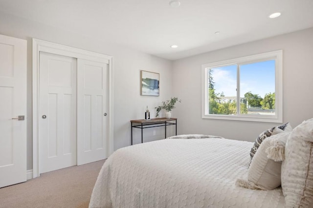 carpeted bedroom with a closet