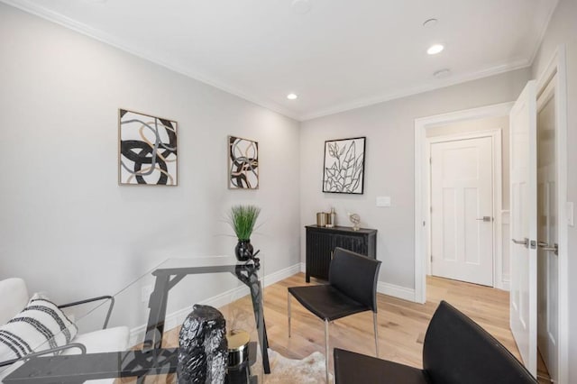 office area featuring ornamental molding and light hardwood / wood-style floors