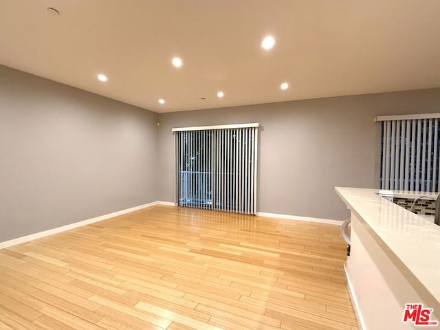 spare room featuring light hardwood / wood-style floors