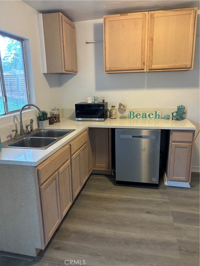 kitchen with appliances with stainless steel finishes, light brown cabinets, dark hardwood / wood-style floors, and sink