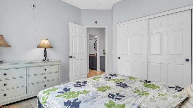 bedroom with a closet and light hardwood / wood-style flooring