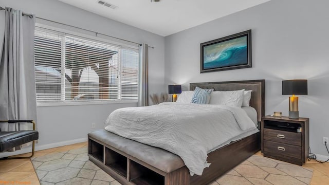 bedroom with light tile patterned flooring