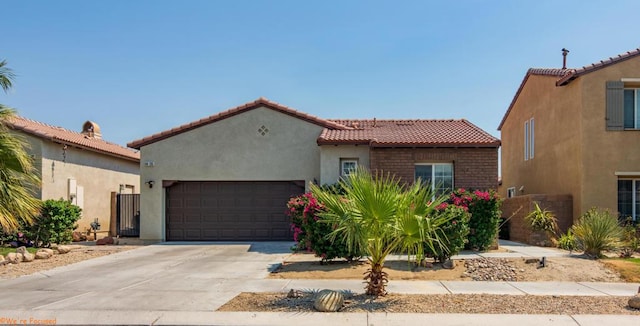 mediterranean / spanish-style home featuring a garage