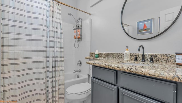 full bathroom with toilet, shower / bath combo, and vanity