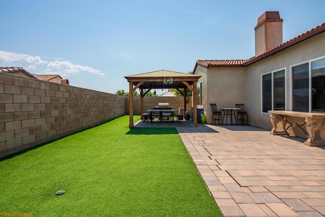 view of yard featuring a gazebo and a patio