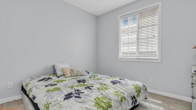 bedroom with light hardwood / wood-style flooring