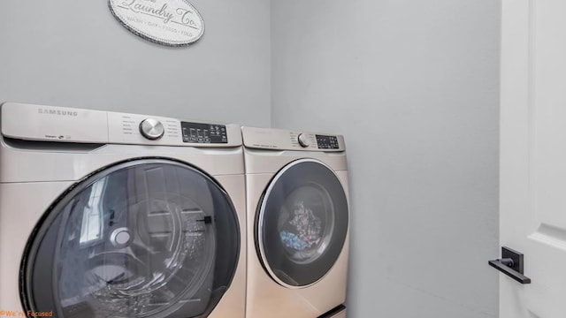 laundry room with washer and dryer