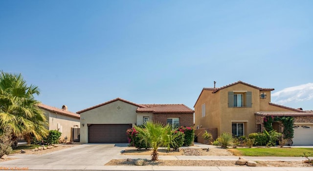 mediterranean / spanish-style home with a garage