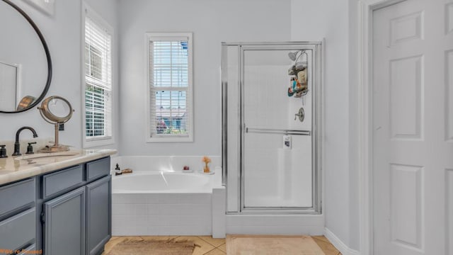 bathroom with tile patterned floors, vanity, and independent shower and bath