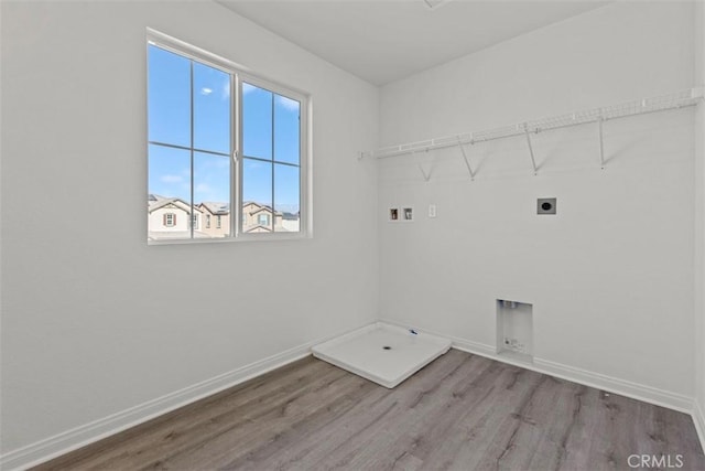 laundry room with washer hookup, wood-type flooring, and electric dryer hookup