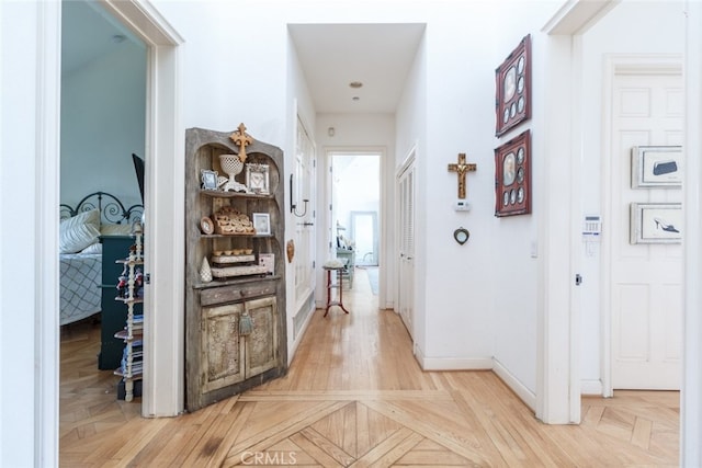 corridor featuring light parquet floors