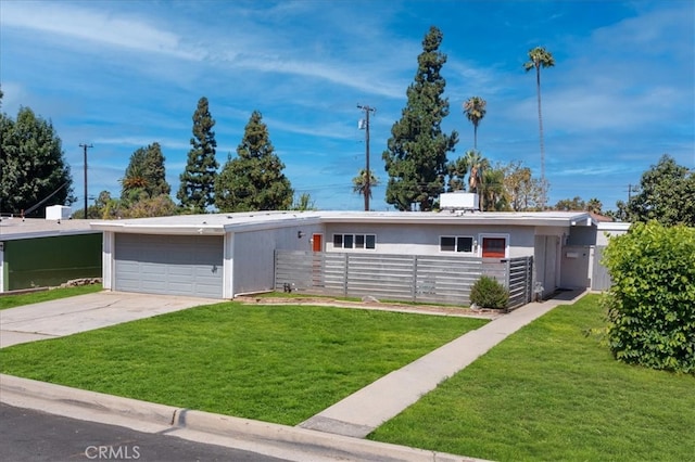 ranch-style house with a garage and a front lawn