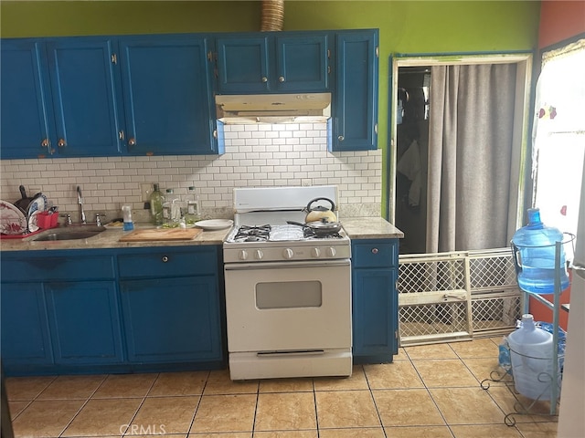 kitchen featuring blue cabinets, custom range hood, and white gas range