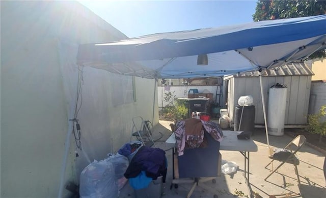 view of patio with water heater