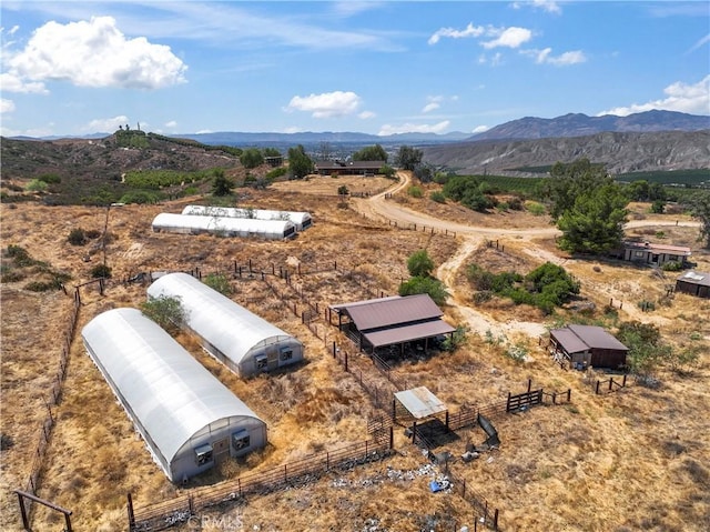 drone / aerial view with a mountain view and a rural view