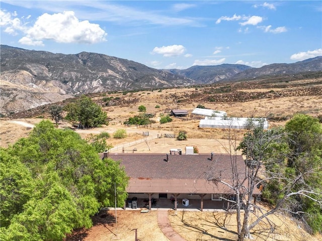 birds eye view of property featuring a mountain view