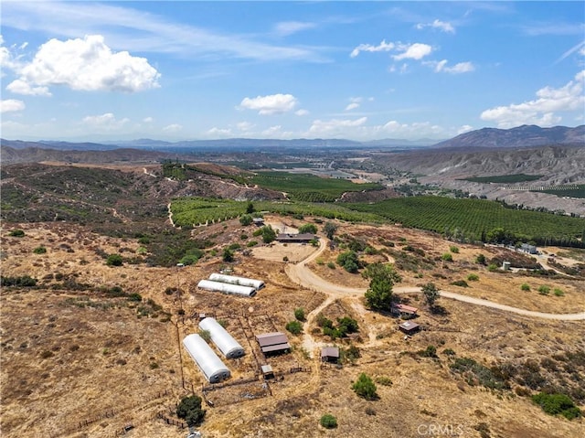 drone / aerial view featuring a rural view and a mountain view