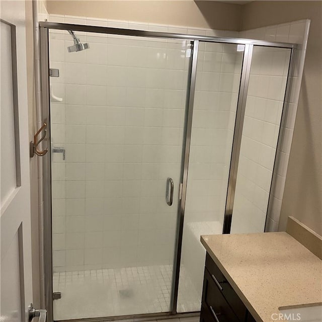 bathroom with vanity and an enclosed shower