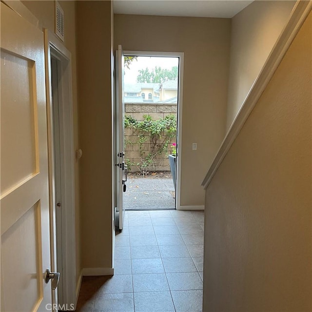 entryway featuring light tile patterned floors