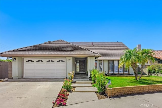 single story home with a garage and a front yard