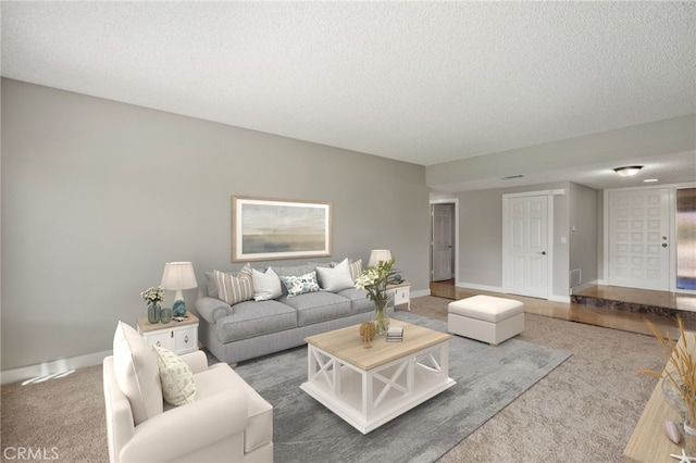 carpeted living room featuring a textured ceiling