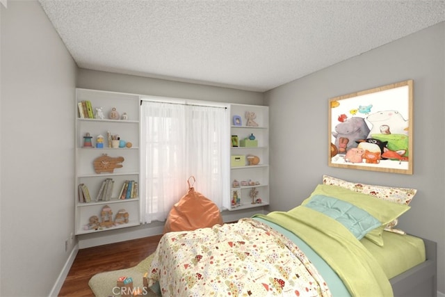 bedroom featuring dark wood-type flooring and a textured ceiling