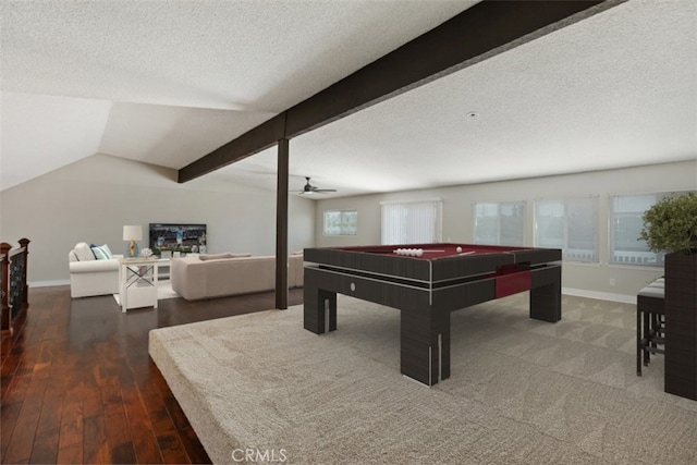 playroom featuring a textured ceiling, pool table, dark hardwood / wood-style flooring, lofted ceiling with beams, and ceiling fan