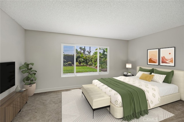 bedroom with carpet and a textured ceiling