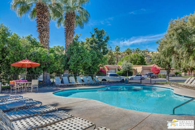 view of swimming pool with a patio