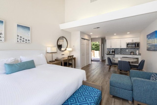 bedroom featuring hardwood / wood-style flooring and a closet